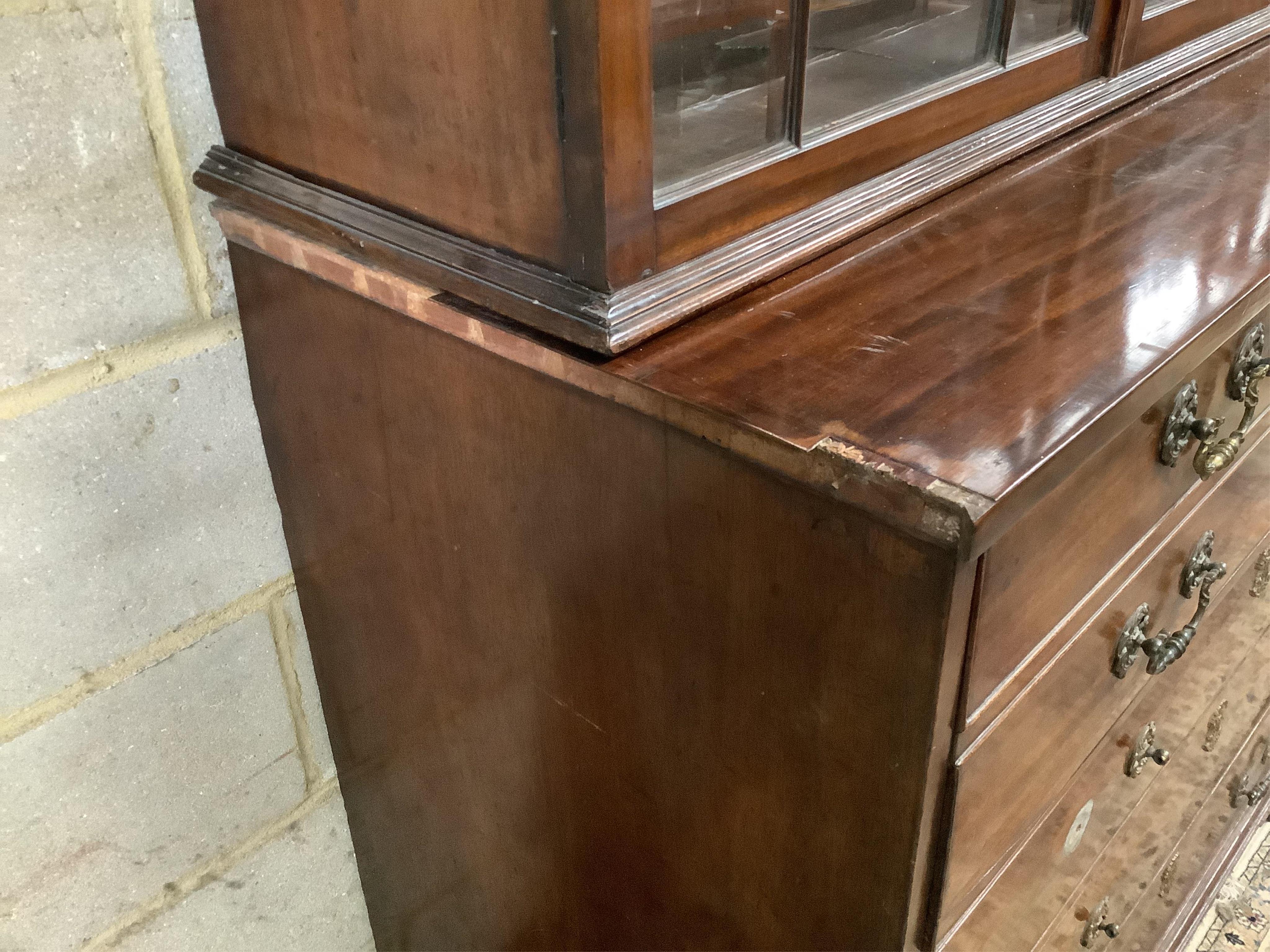 A George III mahogany secretaire chest, fitted with a later glazed two door bookcase, width 112cm, depth 56cm, height 247cm. Condition - poor